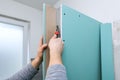 Drywall bulkhead construction in domestic bathroom. cutting gypsum sheet Royalty Free Stock Photo