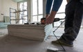 Drywall Installers. Men holding a gypsum board figured cut Royalty Free Stock Photo