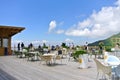 Outdoors cafe on top of mountain with tourists Royalty Free Stock Photo