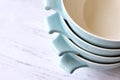 Closeup of a stack of light blue ceramic retro bowls