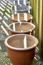 A row of empty pots in a garden Royalty Free Stock Photo