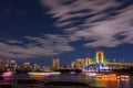 Odaiba, Tokyo, Beautiful and colorful rainbow bridge and Tokyo city night background image, cloudy in motion and left copy space f Royalty Free Stock Photo