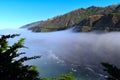 California Ragged Point Mountain with Smooth Fog Coming off the Ocean Royalty Free Stock Photo
