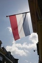 Dutch flag waving in the wind against a blue sky Royalty Free Stock Photo