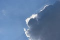 Dark cloud with silver lining against a blue sky Royalty Free Stock Photo