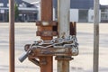 Locked metal fence with chain and padlock