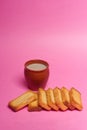 Rusks tea in mud glass pink background