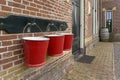 Metal fire buckets hanging in a row at a train station Royalty Free Stock Photo