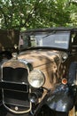 Ford 1931 Model A, front of car, headlight, grill, logo and bird mascot