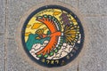 Ho-Oh Pokemon manhole cover street art in Arashiyama Park. Kyoto, Japan Royalty Free Stock Photo