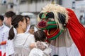 Shishimai lion dance good luck ritual with child at Saga Matsuri. Arashiyama, Kyoto, Japan Royalty Free Stock Photo