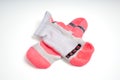 Pair of used pink and white sports socks on isolated white background. Fitness, athletic and performance concept Royalty Free Stock Photo