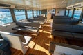 Interior seats and window view inside Lake Lugano ferry boat. Lugano, Canton of Ticino, Switzerland Royalty Free Stock Photo