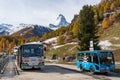 Tourists queuing at Zen Stecken electric shuttle bus stop Zermatt, Canton of Valais, Switzerland Royalty Free Stock Photo