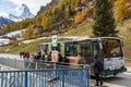 Tourists queuing at Zen Stecken electric shuttle bus stop Zermatt, Canton of Valais, Switzerland Royalty Free Stock Photo