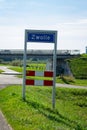 Place name sign of the city of Zwolle, The Netherlands on the river IJssel embankment. Royalty Free Stock Photo