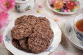 Chocolate cookies Cup of tea Lollipops Party tabletop close-up