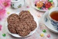 Chocolate cookies Cup of tea Lollipops Party tabletop close-up