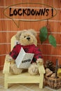 Covid is back. Teddy bear reading newspaper, he is worried about lockdowns Royalty Free Stock Photo