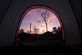 Beautiful Sunrise Morning from iNside of Tent. Camping with SUV Car in Front and Forrest Royalty Free Stock Photo