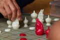 Two Men were Playing in a Serious Thai Style Chess Game.