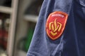 Dutch fire department badge on blue shirt