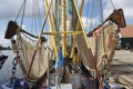 Shrimp boat with nets in the harbour of Zoutkamp Royalty Free Stock Photo