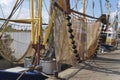 Shrimp boat with nets in the harbour of Zoutkamp Royalty Free Stock Photo