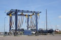 Large empty mobile boat travel lift in a harbour under a blue sky Royalty Free Stock Photo