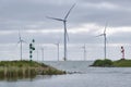 An offshore wind farm from the harbour in the early morning light. Royalty Free Stock Photo