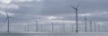 Panorama of an offshore wind farm in the early morning light. Royalty Free Stock Photo