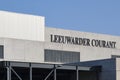 The Leeuwarder Courant logo on the facade of a building