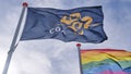 Flag of the COA and a rainbow flag in front of an AZC Royalty Free Stock Photo