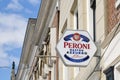 Peroni logo sign on the facade of a restaurant Royalty Free Stock Photo