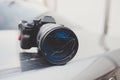 DSLR camera with broken lens filter. Cracked photo-filter Royalty Free Stock Photo