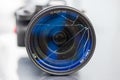 DSLR camera with broken protective glass for lens. Cracked photo-filter Royalty Free Stock Photo