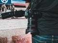 DSLR camera carried by a camera man part of media crew at an live Esports event with confetti on the ground. Royalty Free Stock Photo