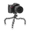 Dslr camera on tripod Royalty Free Stock Photo