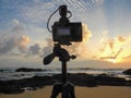 DSLR digital camera on tripod. Seascape and sunrise view. Royalty Free Stock Photo