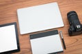 DSLR digital camera with tablet and notebook laptop Royalty Free Stock Photo