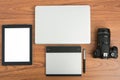 DSLR digital camera with tablet and notebook laptop Royalty Free Stock Photo