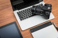 DSLR digital camera with tablet and notebook laptop Royalty Free Stock Photo