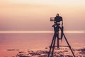 Dslr digital professional camera stand on tripod photographing sea, Royalty Free Stock Photo