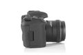 DSLR professional photo camera with a 35 mm lens on plexiglass Royalty Free Stock Photo