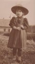 DT00003 HUNGARY CIRCA 1910 - Pretty little country girl with large hat looks curiously at the camera Austro-Hungary Royalty Free Stock Photo