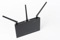 Dual-band gigabit Wi-Fi router with  three antennas. Wireless device on white background Royalty Free Stock Photo