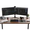 Dual computer monitors displaying code on a desk with peripherals isolated on white background Royalty Free Stock Photo