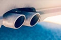 Dual double exhaust pipe. Detail of stylish blue car exterior.