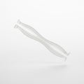 A dual-head silicone nail tool, floating in mid air horizontally on a solid white background Royalty Free Stock Photo
