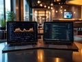 Digital Workspace: Financial Data and Programming Code on Laptops Royalty Free Stock Photo